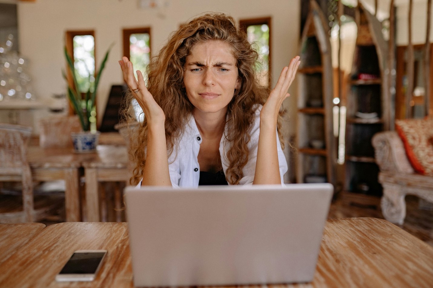 Frustrated woman dealing with weak WiFi signal